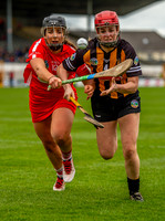 Linda Collins & Grace Walsh chase the loose ball